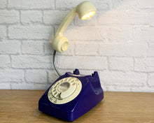 Load image into Gallery viewer, A quirky lamp made from a retro phone. The base of the lamp is a classic dark blue rotary phone with a cream dial & dial ring. The cream handset mounted on a flexible gooseneck has a small LED bulb in the receiver converting it into a fabulous lamp.